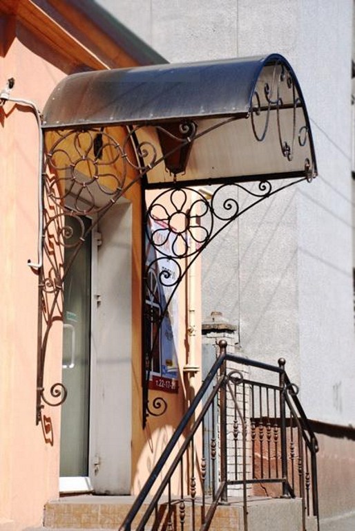 Козырьки с ковкой фото